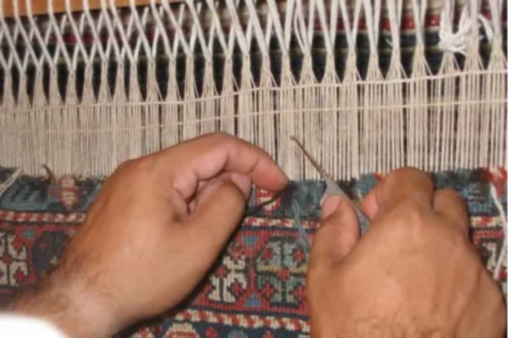Repairing reweaving and restoring a damaged Persian rug