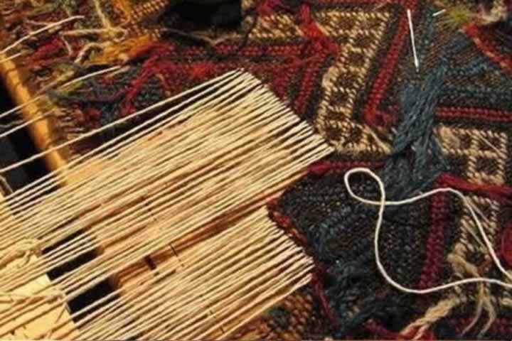 Reweaving a section of a damaged oriental Persian rug