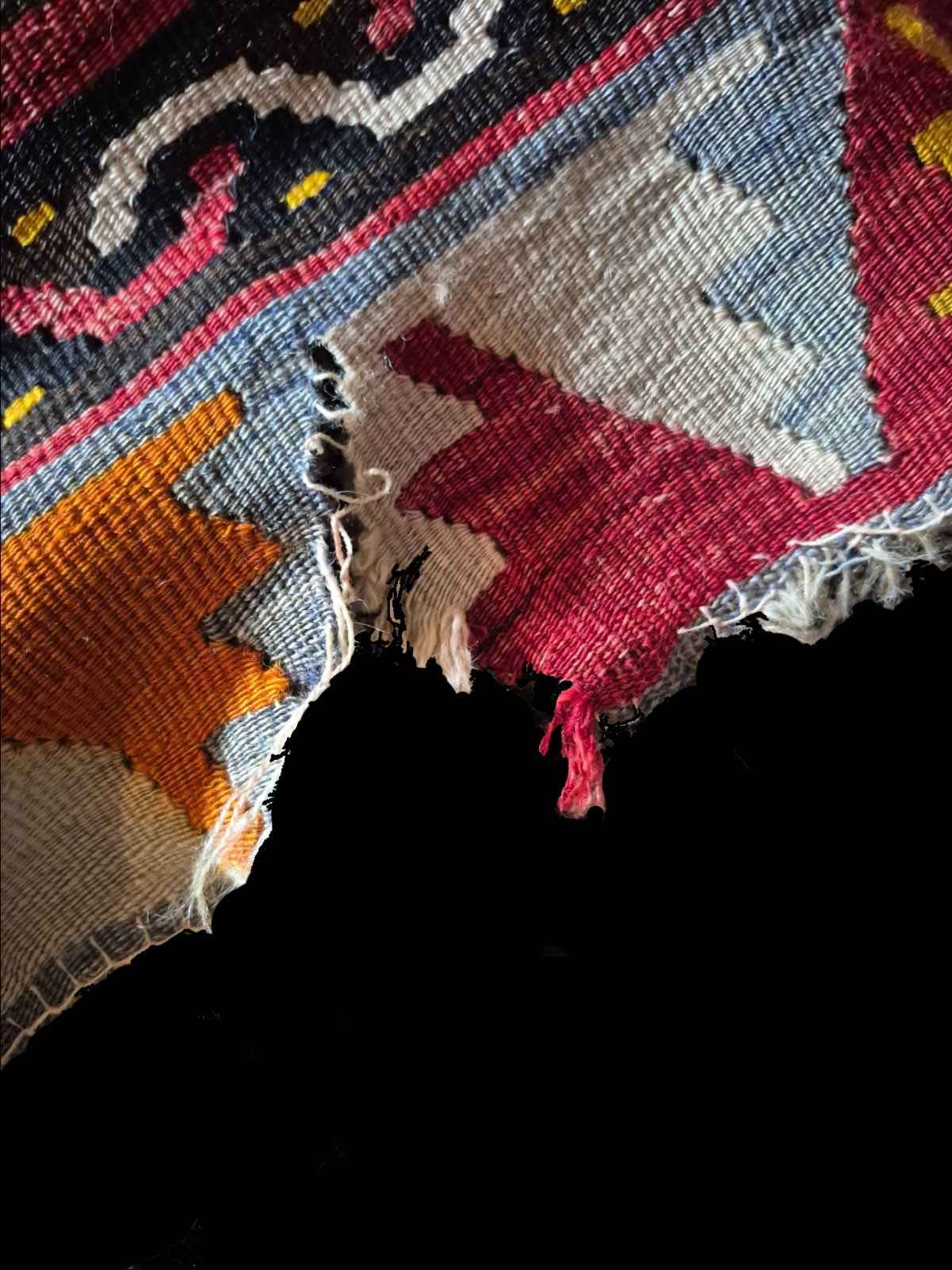 Kilim with ripped edghes before repair & restoration